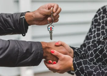 Two people shake hands and one person hands the other a set of keys. Your mortgage payment is not complicated, there's a few things you should know!