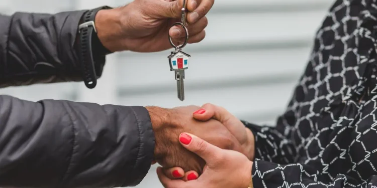 Two people shake hands and one person hands the other a set of keys. Your mortgage payment is not complicated, there's a few things you should know!