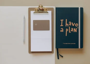 A clipboard and a journal that says I have a plan.