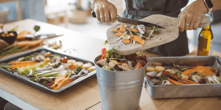 A woman prepares food in the kitchen. Clean out your freezer with these recipes.
