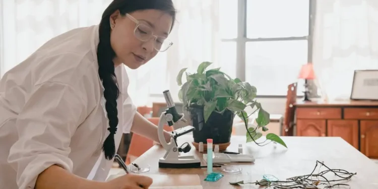 a generation x woman writing on a piece of paper