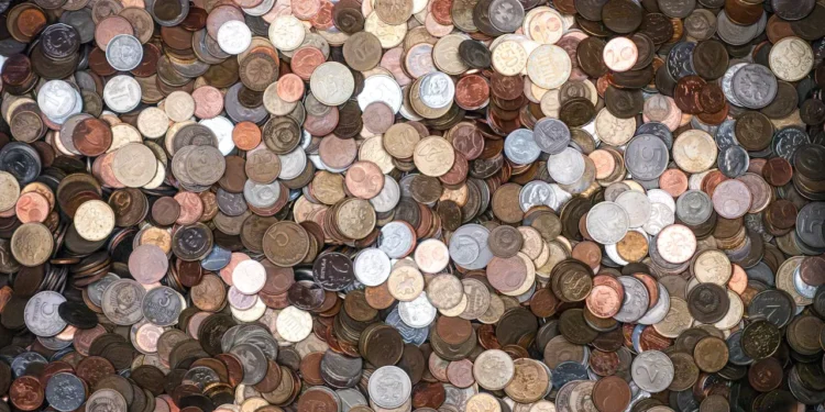 A huge pile of silver and bronze coins. Extreme cheapskates are major penny pinchers.