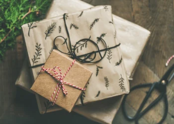 A stack of handmade gift wrapped gifts. Curb your Christmas spending this year!