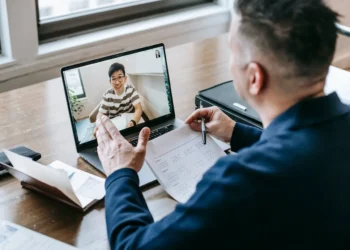 Financial mentor has a video chat with a student.