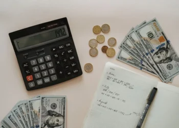 Budgeting related items sit on a desk.