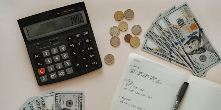 Budgeting related items sit on a desk.