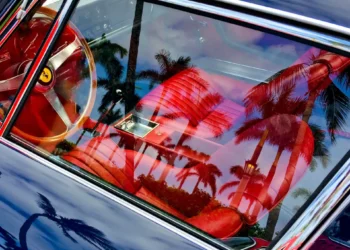 Looking in the window of a luxury vehicle.