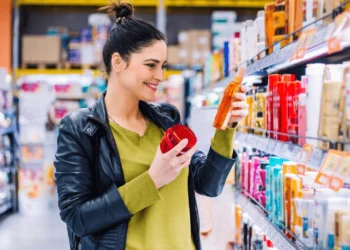 Woman comparison shops for beauty & grooming products.